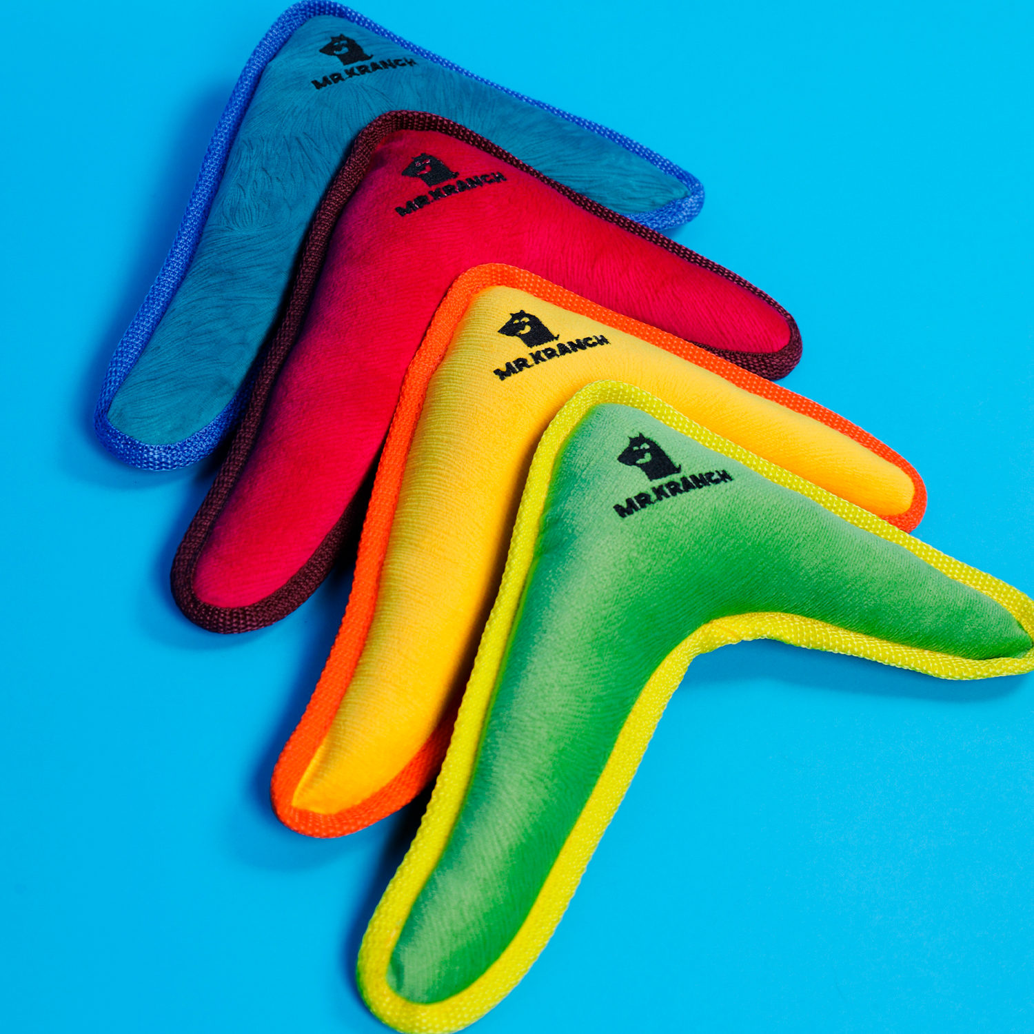 Игрушка Mr.Kranch для собак средних и крупных пород Бумеранг с пищалкой 34х285х65см розовый